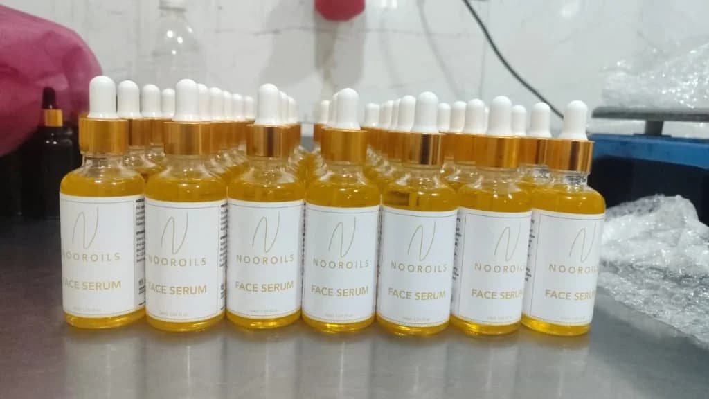 Labeled dropper bottles on a production line